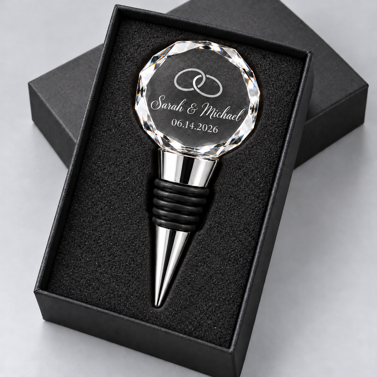 Custom laser engraved K9 crystal wine stopper by Artfil with names and wedding date